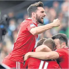  ??  ?? Graeme Shinnie celebrates Jonny Hayes’ winner.