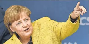  ?? AGENCE FRANCE PRESSE ?? Online agitators aren’t happy with German Chancellor Angela Merkel or her election opponent.