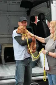  ?? SUBMITTED PHOTO ?? Animal Lifeline volunteer John Busin, left, and Stacy Calvert, West Chester Campus Brandywine Valley SPCA staffer, unload Pickle at the SPCA. Pickle made room for dogs displaced by Harvey and was adopted the next day.