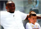  ??  ?? Mateo with Cape Town City coach Benni McCarthy on the sidelines during a match.