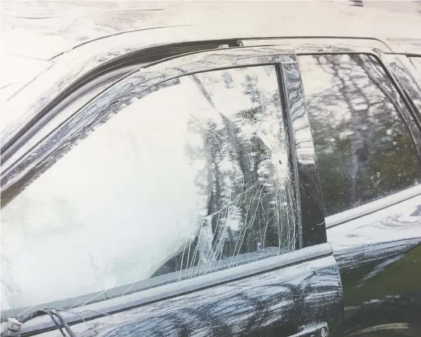  ?? Files ?? A bullet hole is seen in the window of German tourist Horst Stewin’s SUV. Horst was shot in the head while driving west of Calgary in 2018.