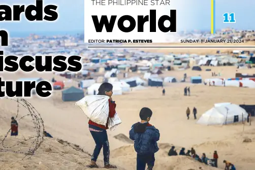  ?? AFP ?? Displaced Palestinia­n children walk on a hill facing their makeshift camp in Rafah, on the southern Gaza Strip at the border with Egypt on Friday.