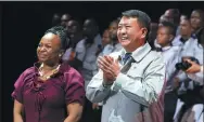  ??  ?? Xu Heyi (right), president of BAIC Group, attends a ceremony to celebrate the first batch of cars produced at its South Africa plant.