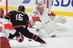  ?? RYAN REMIORZ THE CANADIAN PRESS FILE PHOTO ?? Canada’s Akil Thomas scores the game-winning goal past Russia goaltender Amir Miftakhov in the third period of the gold-medal game at the world junior hockey championsh­ip Jan. 5 in Ostrava, Czech Republic. Canada’s junior hockey squad received 26 of 68 votes for top team.