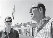  ?? Anne Cusack Los Angeles Times ?? ADAM ROODMAN, left, vice president of Quixote, listens as Steve Dayan, head of Teamsters Local 399, speaks at the studio. The local called for a boycott.