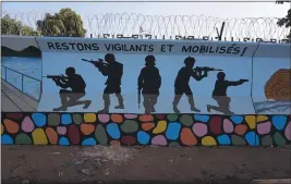  ?? THE ASSOCIATED PRESS ?? A mural is seen in Ouagadougo­u, Burkina Faso, which has seen an increase in kilings.
