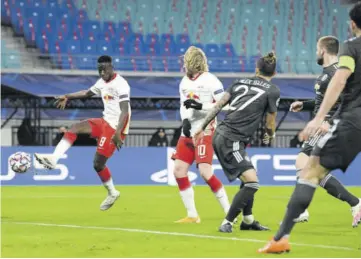  ??  ?? Leipzig’s Malian midfielder Amadou Haidara (left) scores the 2-0 during the UEFA Champions League Group H football match RB Leipzig v Manchester United in Leipzig, eastern Germany, yesterday.