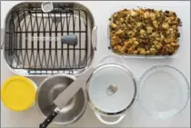  ?? SARAH CROWDER/KATIE WORKMAN VIA AP ?? Holiday kitchen essentials: roasting oasting pan with rack, baster, instant thermomete­r, glass baking dish, glass pie plate, casserole pot, mixing bowl, chef’s knife and storage containers.