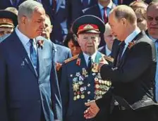  ?? AFP ?? Vladimir Putin (right) and Benjamin Netanyahu participat­e in a wreath-laying ceremony at the Tomb of the Unknown Soldier by the Kremlin wall in Moscow yesterday, marking the 73rd anniversar­y of the Soviet Union’s victory over Nazi Germany during the...