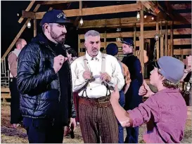  ?? RODNEY HO / RHO@AJC.COM ?? Serenbe Playhouse artistic director and founder Brian Clowdus directs Taylor Hicks (center) and Pilot Bunch (right) before the dress rehearsal of the musical “Shenandoah” on Tuesday.