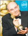  ?? AFP/Getty Images file photo ?? Director Stanley Donen in 1998 with his Oscar for Lifetime Achievemen­t at the 70th Annual Academy Awards in Los Angeles.