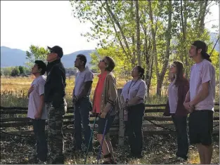  ?? Yvonne Pesquera ?? At the Not Forgotten Outreach Respite Center in Taos, Navy veteran Dutch Shultis organized a group of veterans, supporters and AmeriCorps volunteers in a ceremony to lower the U.S. flag. In his opening words, Shultis said, “We lower the flag in respect for our country and for all those who died.”