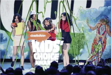  ??  ?? Favourite Music Group winner Fifth Harmony gets the green treatement.