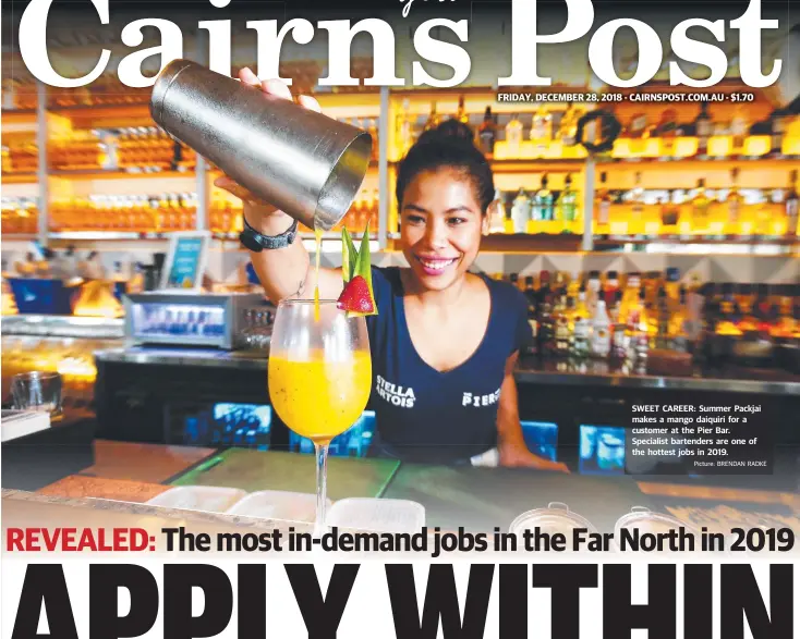  ?? Picture: BRENDAN RADKE ?? SWEET CAREER: Summer Packjai makes a mango daiquiri for a customer at the Pier Bar. Specialist bartenders are one of the hottest jobs in 2019.