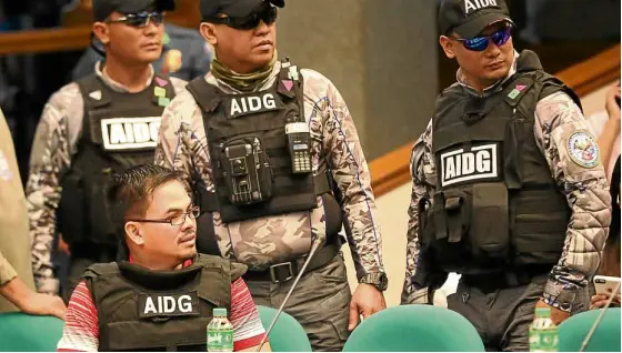  ?? —MARIANNE BERMUDEZ ?? Kerwin Espinosa under heavy guard during his appearance at the Senate on Dec. 5 last year