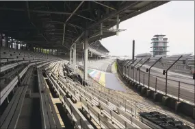  ?? Darron Cummings / Associated Press ?? Indianapol­is Motor Speedway is empty on Sunday. The Indianapol­is 500 was postponed because of the coronaviru­s pandemic. The race will instead be held Aug. 23, three months later than its May 24 scheduled date.