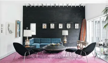  ?? ERIC LAIGNEL/MARKZEFF ?? In their East Hampton, N.Y. home, Mark and Kristen Zeff have embraced black both inside and outside. Black, a landmark shade, is less stark and ultimately more grounding than traditiona­l white.