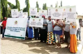  ??  ?? Women under the aegis of Society for Women and Children Living with HIV/AIDS in Nigeria (SOWCHAN ) during their match to the National Assembly recently.