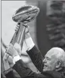  ?? AP PHOTO ?? This Sept. 9, 2010, file photo shows New Orleans Saints owner Tom Benson holding up the Super Bowl trophy before the Saints’ NFL football season opener against the Minnesota Vikings in New Orleans.