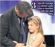  ??  ?? Child Of Courage
winner Lydia Cross is reunited with her dad
Tony