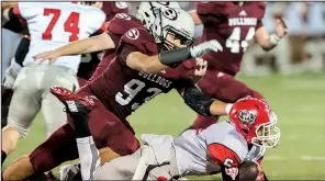  ?? NWA Democrat-Gazette file photo ?? Isaiah Nichols (93) was a disruptive force as a senior at Springdale High School with 30 of his 73 tackles going for lost yards. As a junior, he had 54 tackles, 121/2 for lost yards.