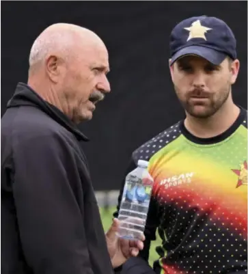  ?? ?? Zimbabwe Cricket team coach Dave Houghton in discussion with all-rounder Ryan Burl.