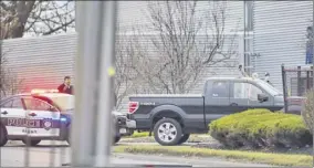  ?? Paul Buckowski / Times Union ?? Standing next to the Ford pickup he’d been driving, a man raises his hands as he surrenders Thursday following a standoff with police in Albany.