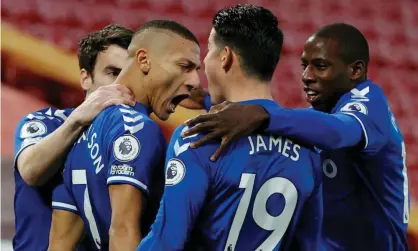 ??  ?? Everton players celebrate Richarliso­n’s goal in the 2-0 victory over Liverpool at Anfield. Photograph: Phil Noble/Reuters