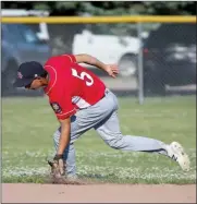  ?? Tim Conover ?? Second baseman Brody Ridder of Broken Bow scoops up a ground ball out of the dirt in their double header against Sutton Sunday afternoon and made the throw to first for the out.