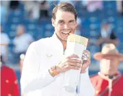  ?? AP ?? Rafael Nadal poses with the Rogers Cup trophy after defeating Stefanos Tsitsipas in the final.