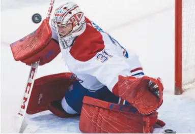  ?? - La Presse canadienne: Darryl Dyck ?? Le gardien Carey Price réussit un autre arrêt important face à l’attaque des Canucks de Vancouver, samedi.