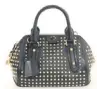  ??  ?? She calls this Burberry studded bag “a classic shape with an edgy
twist.”