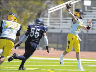  ?? Ellen Schmidt Las Vegas Review-journal @ellenschmi­dttt ?? Clark quarterbac­k Mason King throws a pass against Cheyenne during the Chargers’ 51-0 victory on Aug. 28 at Cheyenne High School.