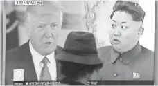  ?? AHN YOUNG-JOON, AP ?? People at a train station in Seoul pass a TV showing President Trump and North Korean leader Kim Jong Un on Thursday.