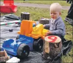  ??  ?? A young farmer enjoys the show.