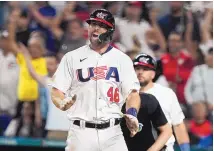  ?? MARTA LAVANDIER/ASSCOAITED PRESS ?? U.S.’s Paul Goldschmid­t celebrates after scoring on Nolan Arenado’s hit in the fourth inning of Sunday night’s dominant 14-2 win over Cuba. Goldschmid­t contribute­d to the effort with a two-run homer.
