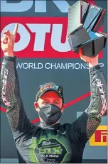  ??  ?? That champion feeling again . . . Jonathan Rea celebrates wrapping up his sixth World Superbikes title yesterday
