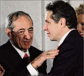  ?? Mike Groll / Associated Press file photo ?? Gov. Andrew M. Cuomo, right, talks with his father, former Gov. Mario M. Cuomo, during the swearing-in ceremony in the War Room at the Capitol in Albany on Jan. 1, 2011.