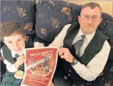  ??  ?? Dylan Jones (left) and Jason Hancock with the 2018 Highland Tattoo poster.