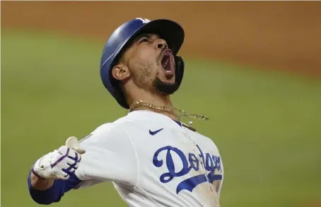  ?? AP FILE ?? SUCCESS ELSEWHERE: The Red Sox traded Mookie Betts instead of letting him walk away in free agency. He helped the Dodgers win their first World Series since 1988.