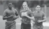  ?? THE ASSOCIATED PRESS ?? Kate Upton faced a tough workout to promote Marine Week.