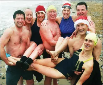  ?? Photo by John Cleary. ?? Tralee Swimming Club members get into a tangle at Fenit on Christmas day swim, included in group Mags O’Sullivan, Bridget Moore, and Mary Fitzsimons, Noel Ryan, Tom Brosnan, Kevin Willians, Declan Crowe, and John Edwards.