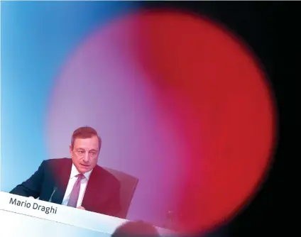  ?? AP FOTO ?? GATHERING SPEED. European Central Bank President Mario Draghi speaks during a news conference following a meeting of the governing council in Frankfurt, Germany. Analysts are not expecting big changes at the ECB’s policy council meeting, with the...