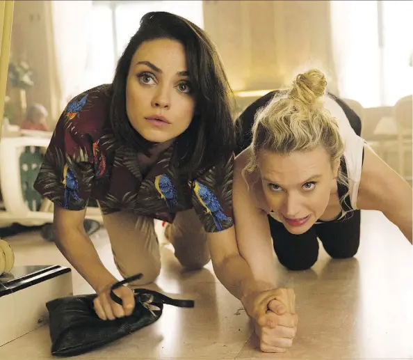  ?? LIONSGATE ?? Kate McKinnon, right, seen with co-star Mila Kunis, steals her scenes in the new comedy The Spy Who Dumped Me.