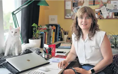  ?? PHOTO: CHRISTINE O’CONNOR ?? Say it with sustainabi­lity . . . Bronwen Hurford, cofounder of The Paper People, in her home office with her Covid19 rescue cat companion Luna. Above left: A sustainabl­e greeting card.