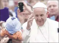  ?? RICCARDO DE LUCA/ASSOCIATED PRESS ?? Pope Francis waves to the faithful as he arrives for his weekly general audience in St. Peter’s Square at the Vatican.