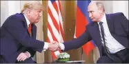  ?? Pablo Martinez Monsivais / Associated Press ?? President Donald Trump, left, and Russian President Vladimir Putin, shake hands at the beginning of a meeting at the Presidenti­al Palace in Helsinki, Finland on Monday.