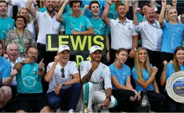  ?? Picture: EPA-EFE ?? LET’S BRING IT HOME, MERCEDES: Lewis Hamilton and Valtteri Bottas will be hoping to bring lots of smiles to their crew, just like they did on that special day at the Hungarorin­g in July.