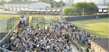  ?? AFP ?? Fans of the Santa Fe HS baseball team attend a game as the community bonded over baseball after Friday’s tragedy.