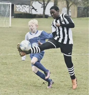  ??  ?? Action from the game between Bretton North End Under 12s and Oundle Town. Bretton won 3-0.